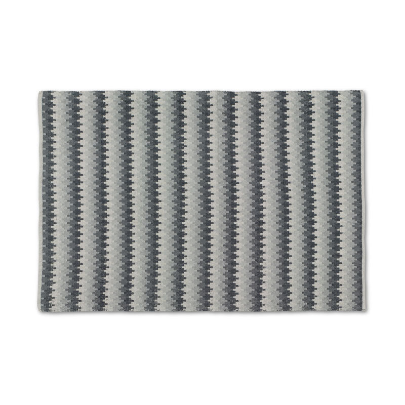 Ethno granit 140 × 200 cm, vävd bomullsmatta med geometriskt mönster i grå, mörka och ljusa nyanser sedd ovanifrån | Molectric